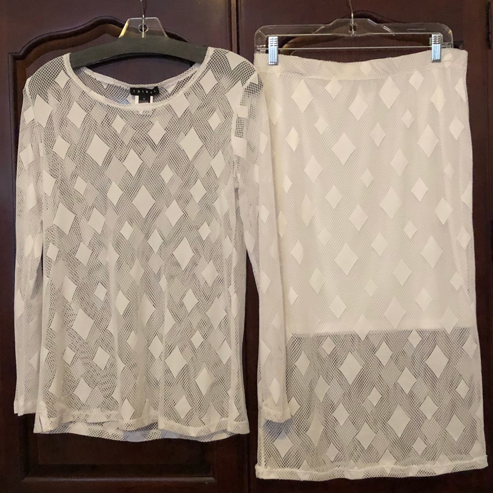 Sheer, white long sleeved top/skirt set.